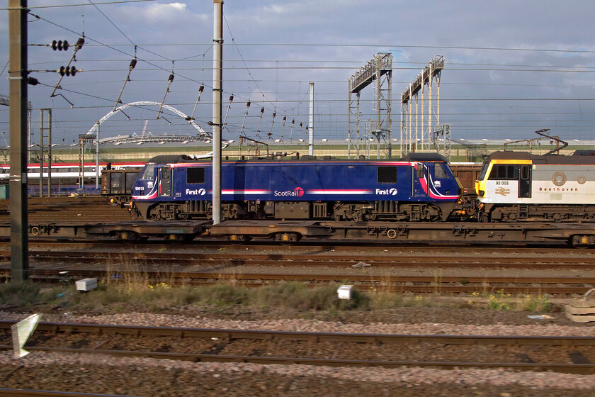 90019 & 92003, stabled, Wembley Yard 
 Catching some pleasant afternoon sunshine in Wembley Yard 90019 in its smart First Group livery contrasts with the ageing paint scheme applied to 92003 'Beethoven'. The Class 92 has worn the triple grey livery since its introduction to service exactly thirty years ago. There is much speculation surrounding these powerful and hugely underused locomotives with talk of this one and a number of others heading back to Europe where there appears to be more work for them. 
 Keywords: 90019 92003 Wembley Yard Beethoven