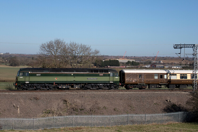 D1924 (47810), 09.50 Liverpool Lime Street-Wembley Central footex (1Z82, RT), Blisworth 
 D1924 'Crewe Diesel Depot' is seen being dragged DIT at the rear of the 09.50 Liverpool Lime Street to Wembley 1Z82 footex charter as it passes Blisworth in Northamptonshire. I have deliberately framed this photograph slightly off-centre to include what appears to be a giant concrete sarcophagus under construction in the background but what is, in fact, a short tunnel that will permit rail access into the huge Sergo Logistics Park (also known as Northampton Gateway) that is under construction close to Junction 15 of the M1. 
 Keywords: D1924 47810 09.50 Liverpool Lime Street-Wembley Central footex 1Z82 Blisworth Crewe Diesel Depot