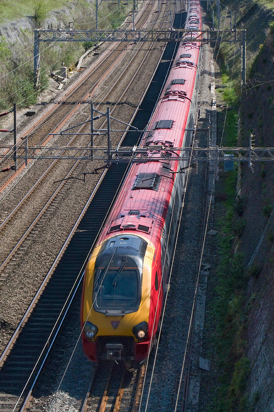 Class 221, VT 13.43 London Euston-Glasgow Central (9S77), Roade cutting 
 A pair of Virgin Voyager class 221s pass through Roade cutting working the 13.43 Euston to Glasgow Central. By this time of year, the sun is just high enough to illuminate the depths of the cutting on the downside as seen here. 
 Keywords: Class 221 13.43 London Euston-Glasgow Central 9S77 Roade cutting Voyager Virgin Trains