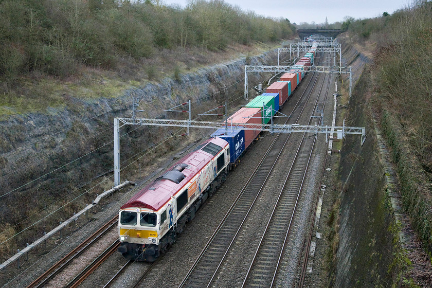 66721, 10.28 Felixstowe North-Hams Hall (4M21), Roade cutting 
 FREIGHT NUMBER FOUR - This is my first photograph of 66721 'Harry Beck' wearing its unique London Underground livery, consisting of all-over white bodysides with a section of the London tube map on its flanks, this side showing the part of the 1933 edition. On the other side is the 2013 map with the respective years marked on the cab ends along with London Underground and London Transport Museum branding. The brightly liveried locomotive certainly brightens up the dismal scene deep in the cutting as it works the 4M21 10.28 Felixstowe North to Hams Hall Freightliner. 
 Keywords: 66721 10.28 Felixstowe North-Hams Hall 4M21 Roade cutting Freightliner