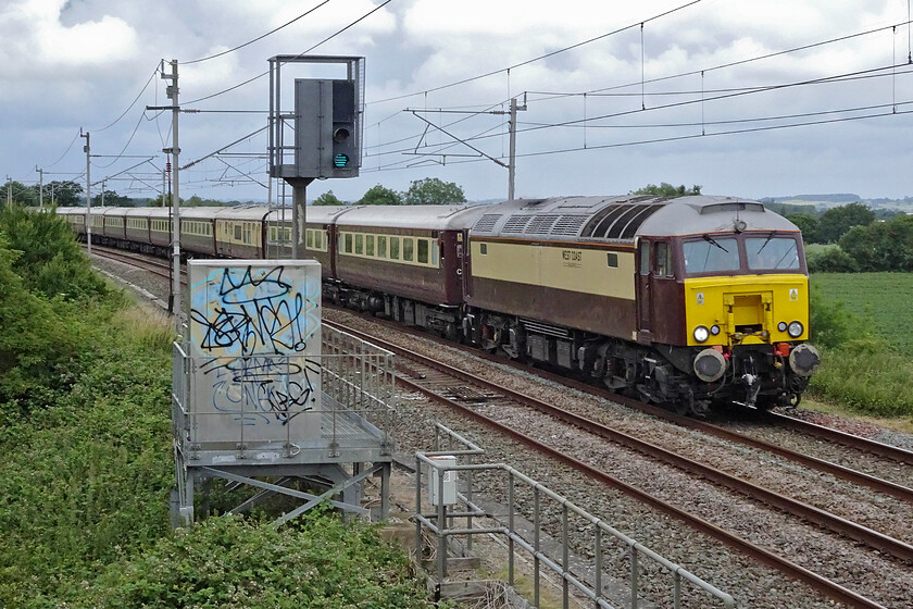 57315, 09.03 London Euston-Milton Keynes (via Rugby) (1Z73, 13L), Milton crossing 
 Having reversed at Rugby the 1Z73 Grand Prix charter train is seen heading south again ready for passengers to disembark at Milton Keynes. WCR's 57315 is seen leading the train past Milton crossing just south of Blisworth. I was surprised to be the only enthusiast at this spot to capture the scene. The fair-paying passengers aboard would later enjoy Lewis Hamilton winning the British Grand Prix in his last season with Mercedes. 
 Keywords: 57315 09.03 London Euston-Milton Keynes via Rugby 1Z73 Milton crossing West Coast Railways