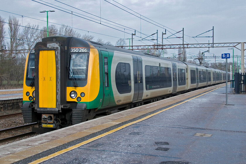 350266, LN 09.06 Birmingham New Street-London Euston (1Y26, RT), Northampton station 
 Our train to London from Northampton arrives at platform one. My wife and I travelled aboard the 09.06 Birmingham New Street to Euston service worked by 350266 and a member of the Class 350/4 subset. We travelled in that one, finding the former first class section almost empty and offering much more seating space. 
 Keywords: 350266 09.06 Birmingham New Street-London Euston 1Y26 Northampton station Class 350 Desiro