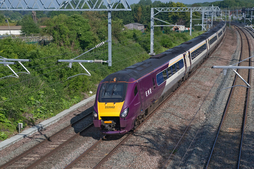 222002, EM 07.46 Nottingham-London St. Pancras (1B19, 3L), Sharnbrook TL001598 
 In the lovely morning sunshine, 222002 takes the curve just north of Sharnbrook Junction working the 07.46 Nottingham to St. Pancras. This is the first time that I have visited this particular location since the wiring was installed. Whilst photographs are still possible, with the use of a ladder now a necessity, the view is not nearly so open as in the past, see..... https://www.ontheupfast.com/p/21936chg/24224333204/x222102-1b13-sharnbrook-junction 
 Keywords: 222002 07.46 Nottingham-London St. Pancras 1B19 Sharnbrook TL001598 EMR East Midlands Railways Meridian