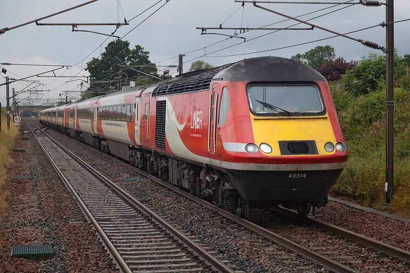 43314 & 43251, GR 07.55 Inverness-London King`s Cross (1E13, 5L), Drem station 
 HST power cars 42314 and 43251 race through Drem working the 07.55 Inverness to King's Cross service. Despite the black sky, it had actually stopped raining and the light was improving considerably from the northeast. The bright red and white LNER livery certainly brightens up a dull day such as this. 
 Keywords: 43314 43251 07.55 Inverness-London King`s Cross 1E13 Drem station