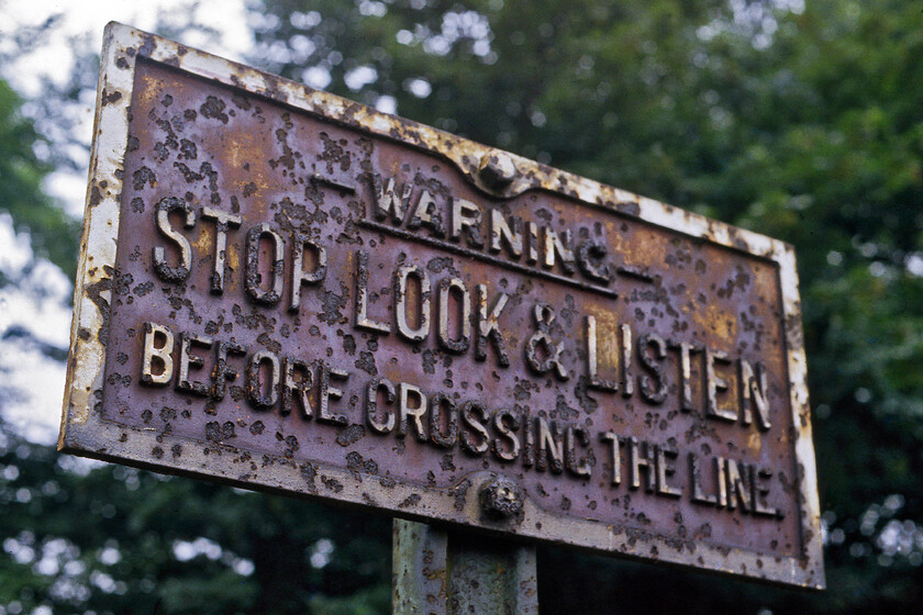 Cast (ex GWR), Bemerton 
 Possibly of GWR heritage, a cast sign warns pedestrians on a foot crossing at Bemerton to the north of Salisbury. The sign was at the point where the GWR independent lines ran from Salisbury station to Wilton. They were parallel with the L&SWR lines for a distance of two miles and fifty-four chains. and were pulled up in 1973 when the lines in the Salisbury area were considerably rationalised. 
 Keywords: Cast GWR Bemerton