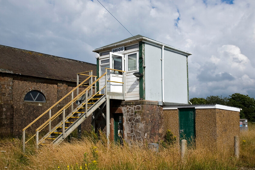 Drigg sIgnal box (Furness, 1871) 
 From the rear Drigg signal box is a little disappointing. Whilst the base is the original stone-built part of the structure, the top has been completely cloaked by UPVC with just the timber uprights remaining from the 1871 box. However, I suppose that given its location exposed on the Cumbrian Coast with everything that this will throw at it efforts to maintain origonality would be tricky and expensive. By way of contrast, the substantial former goods shed is seen on the opposite side of the line and appears to be largely as-built. 
 Keywords: Drigg sIgnal box Furness, 1871