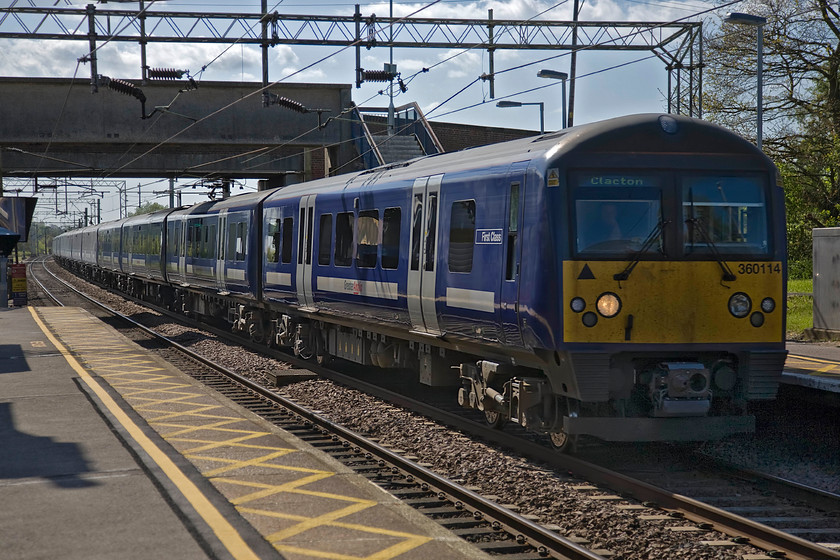 360114, LE 14.18 London Liverpool Street-Clacton-on-Sea (1N26), Hatfield Peverel station 
 Greater Anglia Desiro 360114 hurries through Hatfield Peverel station working the 14.18 Liverpool Street to Clacton-on-Sea service. This service appears to be a twelve coach train made up of three four-car units that seems to be generous for an early afternoon departure from London? 
 Keywords: 360114 14.18 London Liverpool Street-Clacton-on-Sea 1N26 Hatfield Peverel station Abellio Greater Anglia Desiro