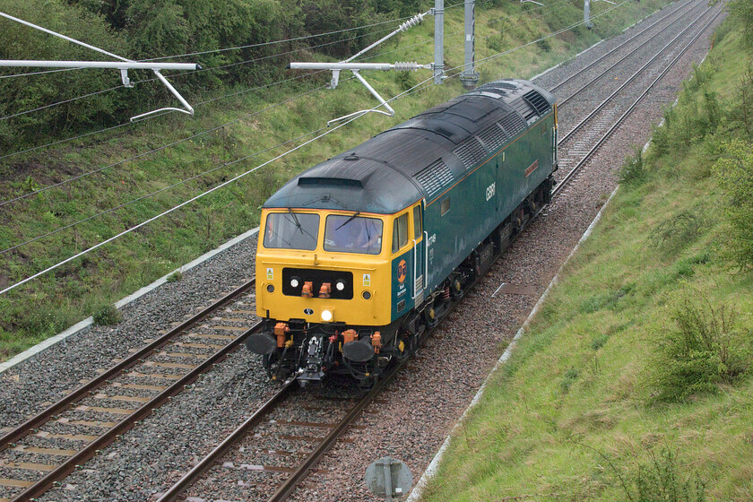 47749, 07.38 Leicester LIP-Cricklewood Depot (0C60 23E), Wymington SP955638 
 I had been monitoring the movement of the 0C60 light engine move on RTT accepting that it would be too late for me to wait for as I had to deliver a customer's car to a garage for work. However, I suddenly became aware that it had missed a layover stop at Kettering and that it was now early. I took a small detour on the way back to the car through a very wet field to the up slow lines near Wymington just managing to capture 47749 'City of Truro' running the 07.38 Leicester LIP to Cricklewood light engine move. 
 Keywords: 47749 07.38 Leicester LIP-Cricklewood Depot 0C60 Wymington SP955638 City of Truro