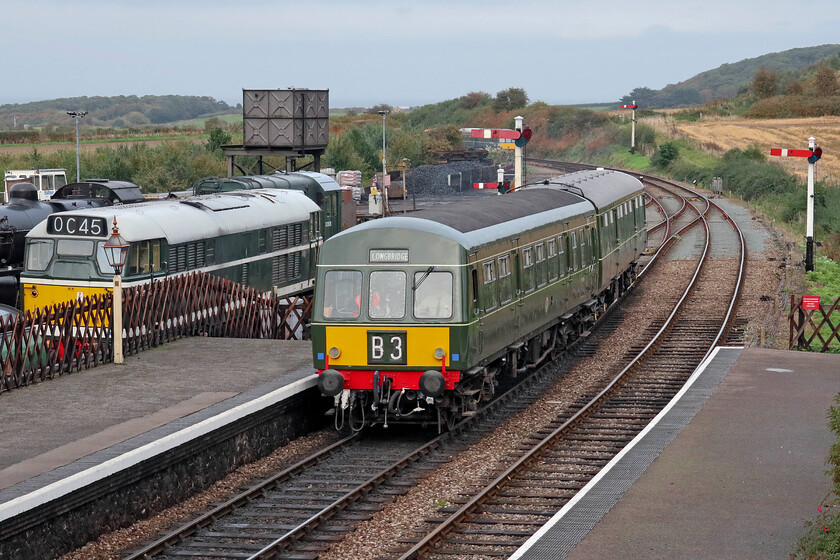 M51188 & M56182, going on shed, Weybourne station-19.10.23 
 Having just returned from Sheringham empty the two-car DMU made up of M51188 and M56182 arrive at Weybourne. After changing ends the crew will then ease the unit into the depot for fueling and servicing ready for their next day in service. Class 31 D5631 is stabled adjacent to the unit. 
 Keywords: M51188 M56182 going on shed Weybourne station Class 101 DMU