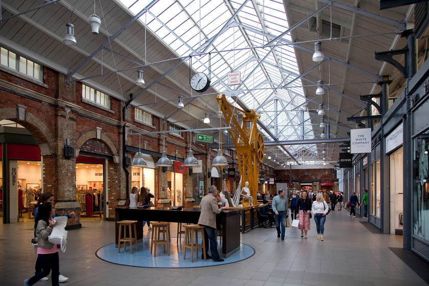 Interior, Swindon Outlet Village 
 A former Swindon Works crane sits in the centre of of one of the malls inside the Swindon outlet village. They have created a nice atmosphere inside but the majority of the customers will fail to notice the heritage items carefully positioned around the 'village'. 
 Keywords: Swindon Outlet Village