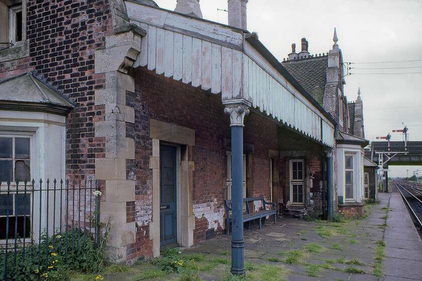 Station building, Brocklesby station 
 Despite the overgrown platform, the broken windows and the peeling paintwork Brocklesby station was still open and served by trains even if the service pattern was not particularly favourable to passengers. Looking back now this was clearly part of BR's deliberate and orchestrated strategy to run down passenger numbers thus creating their case to close it. Closure came on 03.10.93 leaving Ulceby station to the north of the North Lincolnshire triangle and Habrough to the east. To be fair to BR passenger numbers were never particularly strong as the station was located in a rather isolated position some three miles from the village of Brocklesby itself. Allegedly, the station was constructed at the behest of the Earl of Yarborough who also just happened to be the chairman of the Manchester Sheffield and Lincolnshire Railway who also had his own waiting room within the building. The grand station building, built in the familiar Tudor Gothic style used widely throughout the Manchester Sheffield and Lincolnshire Railway network was designed by the architects Weightman and Hadfield. 
 Keywords: Station building Brocklesby station