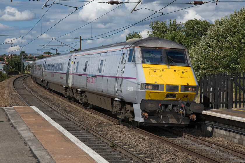 82215, GR 10.00 Edinburgh Waverley-London King's Cross (1E10), Grantham station 
 DVT 82215 leads the 10.00 Edinburgh Waverley to King's Cross at pace through Grantham station. Whilst the DVTs pass with no fuss apart from the usual track noise when the Class 91 does so at the rear (in the case of up trains) there is a lot of mechanical noise that for an electric is unusual. 
 Keywords: 82215 10.00 Edinburgh Waverley-London King's Cross 1E10 Grantham station East Coast DVT