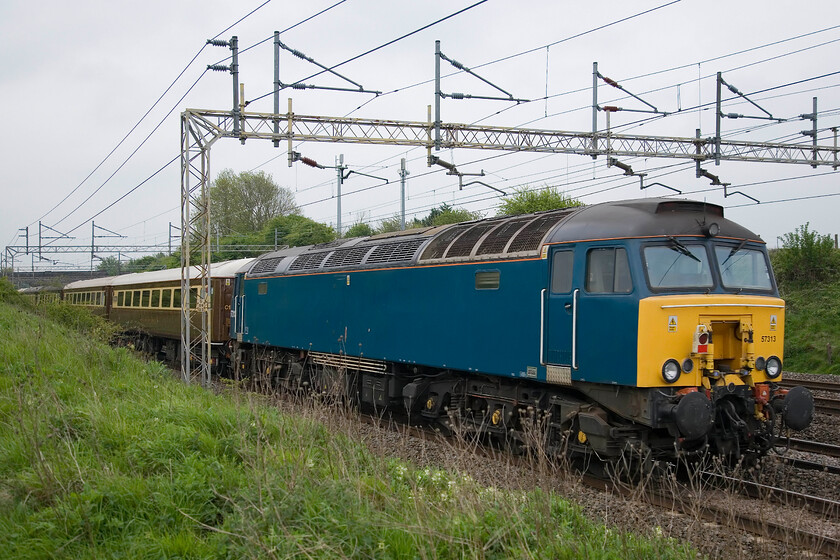 57313, outward leg of The Golden Arrow Statesman, 06.52 Birmingham International-Canterbury (1Z77, 5L), Roade Hill 
 57313 brings up the rear of The Golden Arrow Statesman charter as it passes between the Northamptonshire villages of Roade and Ashton. Running as 1Z77 the charter left Birmingham International at 06.52 and on arrival at Acton Lane 34067 'Tangmere' would take over to complete the run to Canterbury. 
 Keywords: 57313 The Golden Arrow Statesman 06.52 Birmingham International-Canterbury 1Z77 Roade Hill Statesman rail