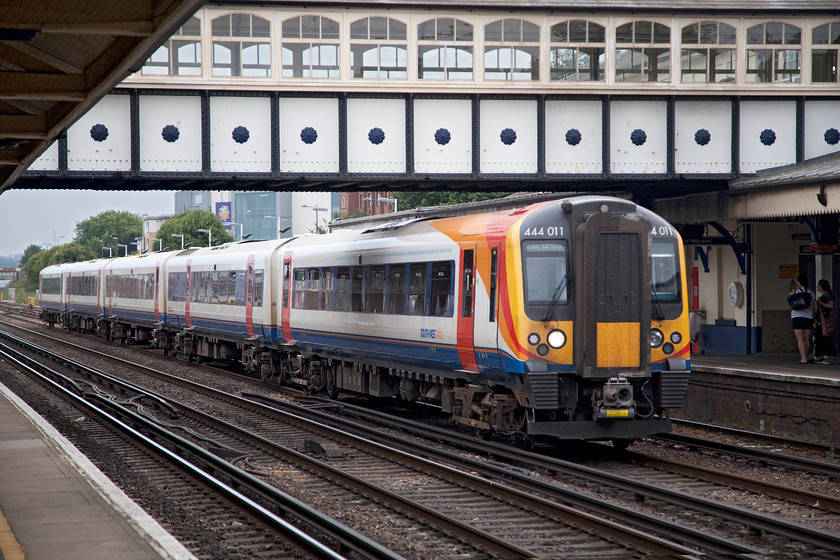 450011, SW 16.03 Weymouth-London Waterloo (1W26, 1E), Eastleigh station 
 450011 speeds through Eastleigh station working the 16.03 Weymouth to London Waterloo. The station was opened very early in 1839 by the LSWR and was called Bishopstoke. It's a busy station today with three platforms, the majority of trains rattle through on the middle roads as shown here. 
 Keywords: 450011 1W26 Eastleigh station