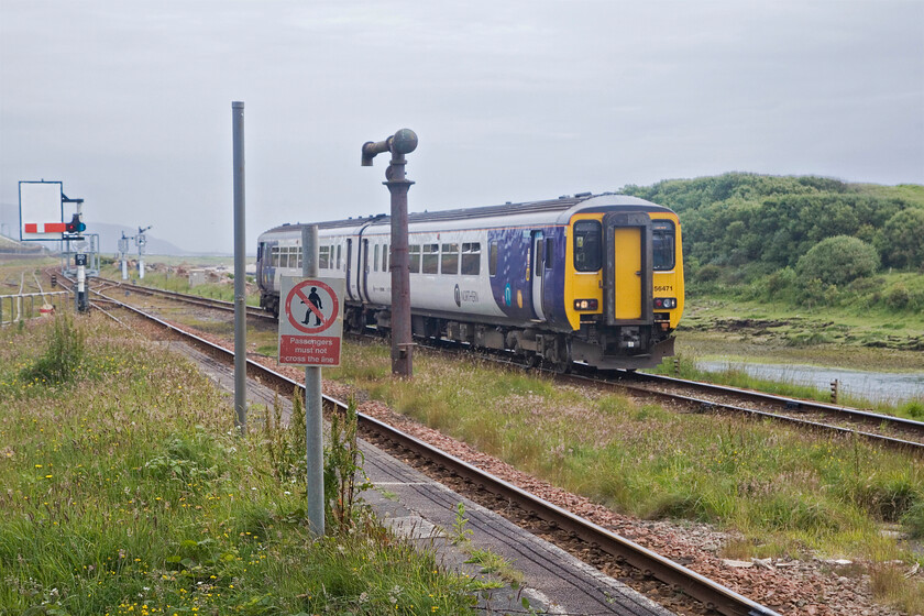 156471, NT 13.19 Lancaster-Carlisle (2C57, 4L), Sellafield station 
 156471 arrives at Sellafield station working the 13.19 Lancaster to Carlisle service. Behind me, the platforms were busy with passengers who had finished their shifts at the nuclear reprocessing facility. It begged a conversation between Andy and me in who dictates the stopping pattern at Sellafield? Is it Northern who works around the Sellafield shifts or is it the other way around? 
 Keywords: 156471 13.19 Lancaster-Carlisle 2C57 Sellafield station Northern