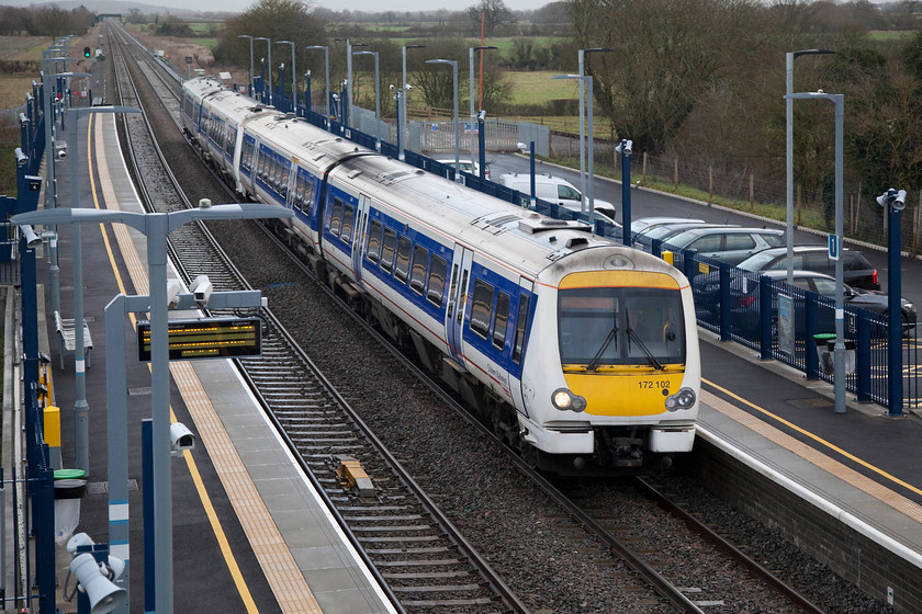 172102 & 172103, CH 08.41 London Marylebone-Oxford (1T15), Islip station 
 This was my first visit to to the recently re-opened Oxford to Bicester line. We pulled of the A34 and made a diversion to the brand new station at Islip. This replaced the meagre one platform affair that had sufficed for a number of years. Chiltern's 172102 and 172103 pass through Islip working the 08.41 London Marylebone to Oxford. The small car park is surprisingly empty given it's weekday morning. One vehicle about to leave is my Combo van, second one from the far end. 
 Keywords: 172102 17210 1T15 Islip station