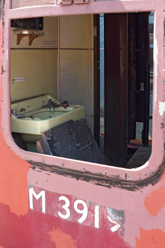 M3919, toilet compartment, Pitsford sidings 
 I does not look like anybody will be using the toilet and hand basin in the compartment of Mk. 1 carriage M3919! This coach was built at Eastleigh as part of lot 30086 sometime between 1953 and 1955. This particular example has had its vacuum brakes restored. Let's hope it can be in use again soon when funds allow. 
 Keywords: M3919 Pitsford sidings