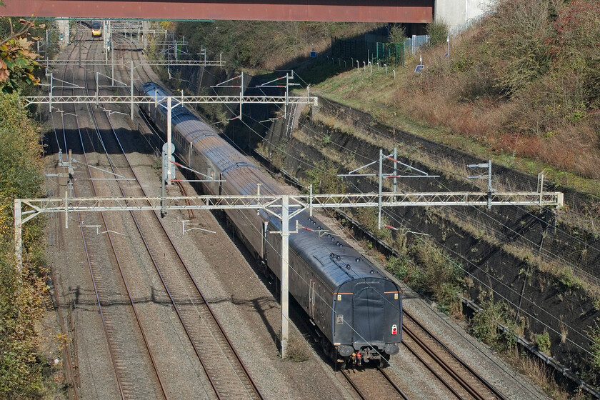 37884, 11.25 Wolverton Centre Sidings-Carlisle (5N09, 68E), Roade cutting 
 I don't do going away shots as a rule but have made an exception today by photographing the 5N09 11.25 Wolverton to Carlisle stock move. Out of sight at the front 37884 'Cepheus' is towing the short set Mk. III stock returning to ScotRail for use on their HSTs. 
 Keywords: Cepheus 37884 11.25 Wolverton Centre Sidings-Carlisle 5N09 Roade cutting