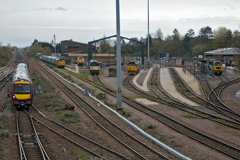 170416, XC unidentified up working, 50007, 67027, 58023, 50049, 47749 & 60028, Leicester North 
 With the cancellation and late running affecting many CrossCountry services I have been unable to identify 170416s working. Certainly, it does not appear on RealTimeTrains so it could be an emergency ECS working from Derby to make up for the set that failed earlier. It is slowly making its way into Leicester station seen passing UKRLs expansive and expanding depot taken from Swain Street bridge. In the depot from left to right is 50007 Hercules, 67027, 58023, 50049 Defiance, 47749 City of Truro and 60028. It s gladdening that UKRL is making use of this old motive power even though the Class 58 centre stage here is not a runner. 
 Keywords: 170416 unidentified up working 50007 67027 58023 50049 47749 60028 Leicester North