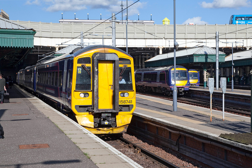 158741, SR 17.05 Edinburgh Waverley-Dunblane (2P35), 170417, SR 17.37 Edinburgh Waverley-Aberdeen (1A81) & 170408, SR 17.11 Edinburgh Wavereley-Kirkcaldy (2K41), Edinburgh Waverley station 
 A busy scene at the Western end of Waverley station sees three commuter workings that will leave soon. From left to right, 158741 will work the 17.05 to Dunblane, 170417, the 17.37 to Aberdeen and 170408, the 17.11 to Kirkcaldy. 
 Keywords: 158741 17.05 Edinburgh Waverley-Dunblane 2P35 170417 17.37 Edinburgh Waverley-Aberdeen 1A81 170408 17.11 Edinburgh Wavereley-Kirkcaldy 2K41 Edinburgh Waverley station