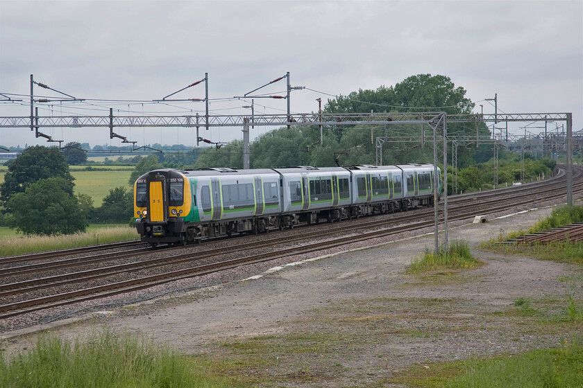 350126, LM 08.02 Crewe-London Euston (1U22), Gordon's Lodge 
 350126 races down the up fast line in between infinitely faster services working the 08.02 Crewe to Euston train. The train is seen passing a remote spot on the southern WCML named Gordon's Lodge between Northampton and Wolverton. 
 Keywords: 350126 08.02 Crewe-London Euston 1U22 Gordon's Lodge London Midland Desiro