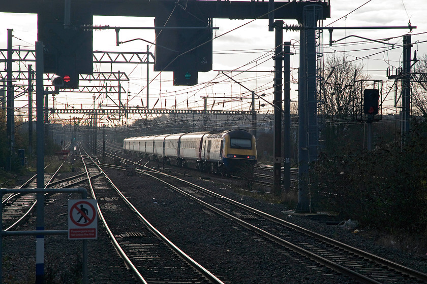 Class 43 (EMT power cars), 06.55 Skipton-London King`s Cross (1A13), Alexandra Palace station 
 Virgin East Coast was experiencing a persistent shortage of stock so it has had to hire in and HST from, in this case, East Midlands Trains. Here, the unidentified set in question heads south past Alexandra Place station with the 06.55 Skipton to London King's Cross. I know that taking into the sun is frowned upon by the purists, but, I like the atmosphere evoked in this particular image. 
 Keywords: Class 43 06.55 Skipton-London King`s Cross 1A13 Alexandra Palace station