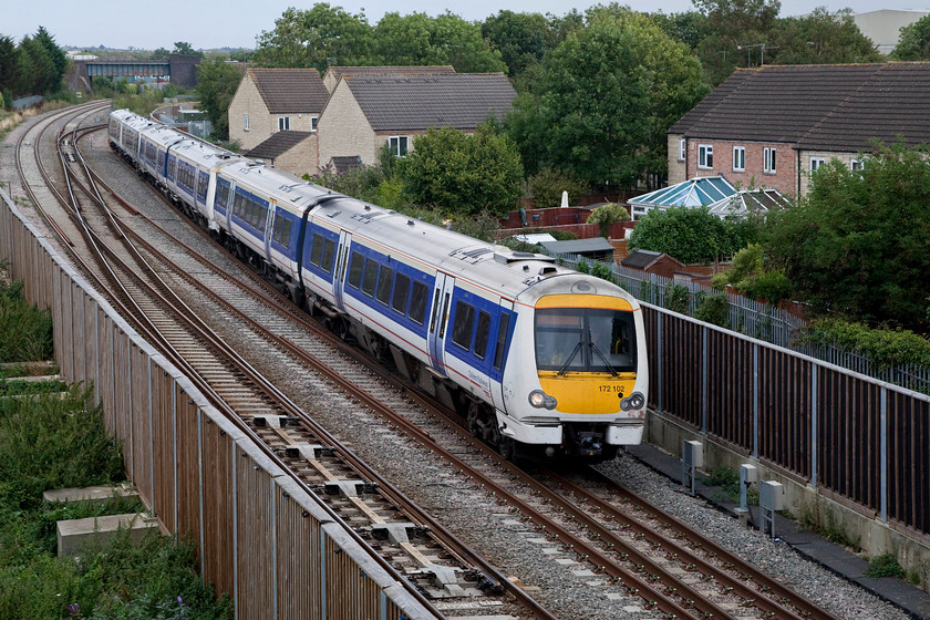 172102, class 16X & 168323, CH 14.02 London Marylebone-Oxford (1T37, 2L), Bicester Gavray Junction 
 172102 leads two other units over the recently created Gavray Junction. In the distance, the double track to the left under the bridge is the yet to be re-built east-west rail link...perhaps? The line curving off to the right is the Bicester south west chord that links the east-west line to the Marylebone to Birmingham main line. The train is about to call at the renamed and rebuilt Bicester Village station before it continues to Oxford as the 14.02 ex London Marylebone. 
 Keywords: 172102 168323 1T37 Bicester Gavray Junction