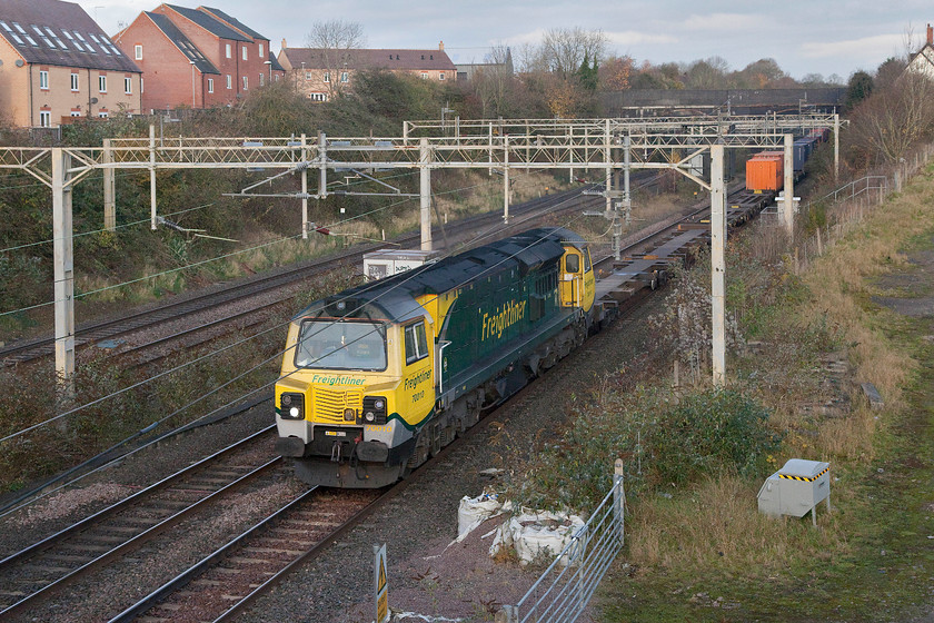 70010, 03.35 Garston-London Gateway (4L52), site of Roade station 
 With some welcome early morning brightness, 70010 leads the regular 4L52 03.35 Garston to London Gateway Freightliner past the site of Roade station. Whenever a class 70 is working past Roade (where I live) it usually stands out as they are a lot noisier than the usual class 66 fare! 
 Keywords: 70010 03.35 Garston-London Gateway 4L52 site of Roade station