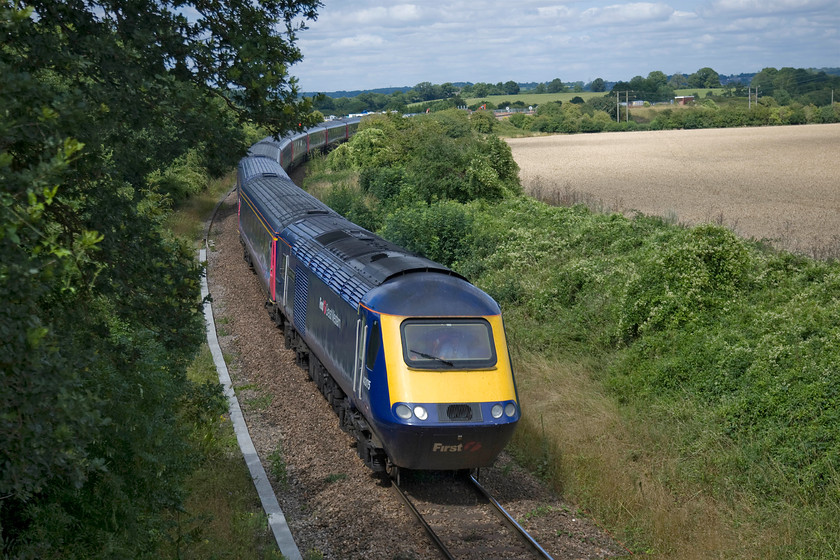 43175, GW 13.00 London Paddington-Bristol Temple Meads (1C15), diverted because of electrification work in Box tunnel, Thingley Junction 
 Having just left the speedy GWML at Thingly Junction located between the power pylons to the top right of the image, 43175 'GWR 175th Anniversary' leads the 13.00 Paddington to Bristol 1C15 service on to the single track section towards Trowbridge past Melksham. After passing Bradford West Junction, it will reverse and travel down the glorious Avon Valley to rejoin the mainline at Bathampton Junction. The cause of all these shenanigans was the closure of Box tunnel for electrification works. 
 Keywords: 43175 13.00 London Paddington-Bristol Temple Meads 1C15 diverted because of electrification work in Box tunnel, Thingley Junction First Great Western HST GWR 175th Anniversary