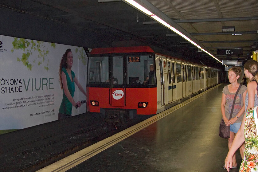 14072, TMB Fondo-Hospital de Bellvitge working, Universitat station - 10.08.13 
 TMB (Transports Metropolitans de Barcelona) operates most of the Metro services in Barcelona along with FGC (Ferrocarrils de la Generalitat de Catalunya) and a very slick operation it is, with regular modern trains and smart stations. One of the older units in operation, A Series 4000, 14072, arrives at Universitat station on Line 1. My wife, son and I took this unit to Espanya where we were thrilled to watch the incredible Magic Fountain of Montjuc (Font mgica de Montjuc) display that takes place on several evenings every week during the tourist season.

NB I read that the display has been suspended for the 2024 season due to the unprecedented drought in Catlinoa (note added December 2024) 
 Keywords: 14072 Fondo-Hospital de Bellvitge working, (Universitat-Espanya) Universitat station