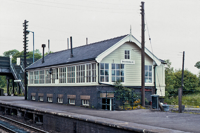 Brocklesby Junction signal box (GC, 1912) 
 The sight of a signal box located on a platform of a station is not a particularly common occurrence. Brocklesby Junction box is also rather squat which I suspect is due to sighting issues created by the B1211 road bridge directly to the west of the station as seen to the extreme left of the photograph. The box is a Great Central structure dating from 1912 located close to what was the far north eastern extremity of their network. The box closed in December 2015 but still stands, if boarded up, as it is a Grade II listed structure. Incidentally, the station is also closed but some years earlier than the box back in October 1993. 
 Keywords: Brocklesby Junction signal box GC 1912 Great Central Railway