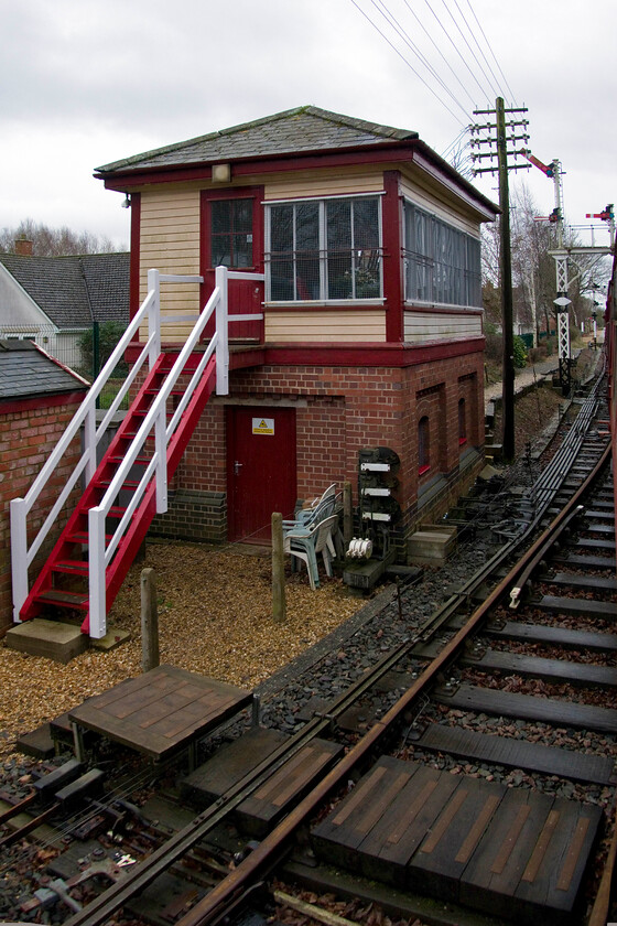 Boughton signal box (Ex Betley Road, LNWR, 1875) & station from 14.00 Pitsford & Brampton return 
 Taken from the train and my run on the Northampton and Lamport's southern extension to Boughton station their re-built signal box is seen. Whilst the base is new the top is from the former Bentley Road box near Norton Bridge. It is a Type 3 box that was originally opened in 1875 when the line south from Crewe was quadrupled. The NLR has certainly done a smashing job restoring it with it controlling all the signalling and point work at their southern extension. 
 Keywords: Boughton signal box Ex Betley Road LNWR station from 14.00 Pitsford & Brampton return