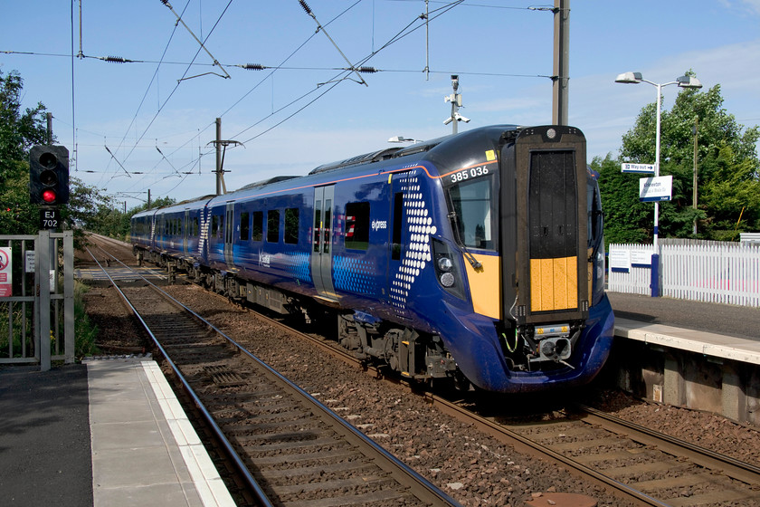 385036, SR 09.17 Glasgow Central-Edinburgh Waverley (2Y48, RT), Kirknewton station 
 385036 enters Kirknewton station working the 09.17 Glasgow Central to Edinburgh Waverley that has travelled via Carstairs. These Hitachi Rail built units, seemingly like all new trains, have been fraught with a number of problems that went so far as to force their squadron withdrawal until a 'fix' was found. The most bizarre fault was with drivers seeing 'pairs' of signals in certain lighting conditions due to the unusual curvature of the windscreens. It is believed that the cure for this was very expensive involving the replacement of all the 'screens with some completely re-designed units. 
 Keywords: 385036 09.17 Glasgow Central-Edinburgh Waverley 2Y48 Kirknewton station