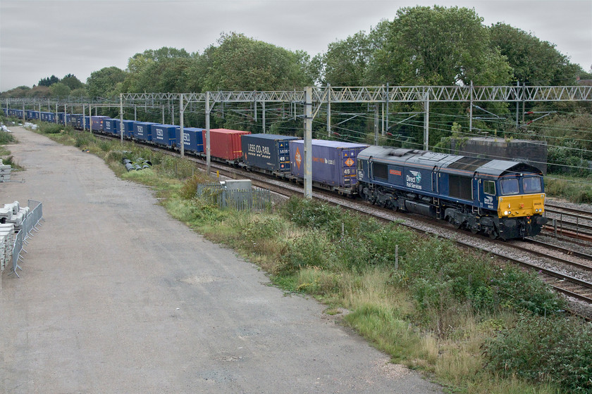 66428, 11.05 Tilbury-DIRFT (42L), site of Roade station 
 66428 'Carlisle Eden Mind' leads a new freight flow that has appeared on the timetable and ran for the last two weeks - the Sunday only 11.05 Tilbury to Daventry Tesco Express. It certainly appears to be a well-patronised working judging by the healthy number of boxes seen in this image as the train passes the site of Roade station. 
 Keywords: 66428 11.05 Tilbury-DIRFT 42L site of Roade station DRS Carlisle Eden Mind