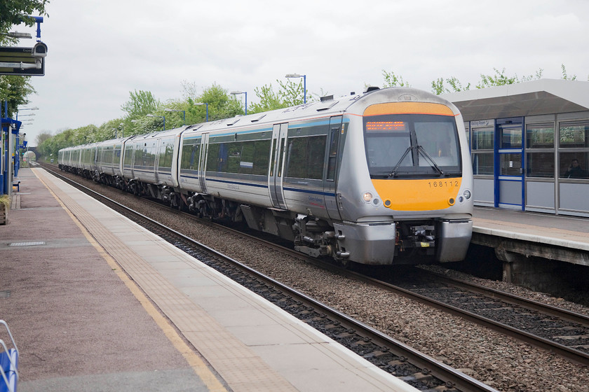 168112, CR 09.55 Birmingham Moor Street-London Marylebone (1H30, RT), Haddenham & Thame Parkway station 
 168112 leads an eight-car set into Thame and Haddenham Parkway station working the 09.55 Birmingham Moor Street to Marylebone. The station opened in 1987 but was re-opened at it present site in 1998 and since then it has gone through a number of changes to cope with the vast increase in passenger usage. It is stories like this that illustrate what a tremendous renaissance that the railways have gone through in recent years. 
 Keywords: 168112 1H30 Haddenham & Thame Parkway station