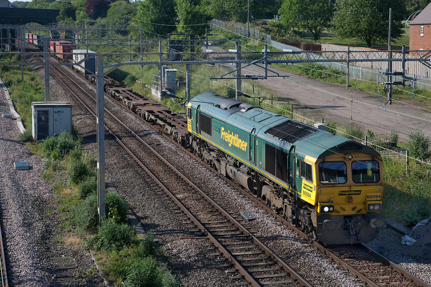 66594, 14.03 Ditton-Felixstowe North (4L92, 7E), site of Roade station 
 If the timetable is all going to plan with a good service operating, between 17.30 and 18.15 around my home village of Roade on the WCML there are four freights that pass in very close succession (three up and one down). The 4L92 14.03 Ditton to Felixstowe passes the site of the village's former station with 66594 'NYK Spirit of Kyoto' leading. In common with a lot of freight at the moment, there was a lot of fresh air being carried along behind the locomotive. In fact, it has just been reported that freight levels have haemorrhaged away as a result of the COVID-19 crisis. 
 Keywords: 66594 14.03 Ditton-Felixstowe North 4L92 site of Roade station Freightliner NYK Spirit of Kyoto