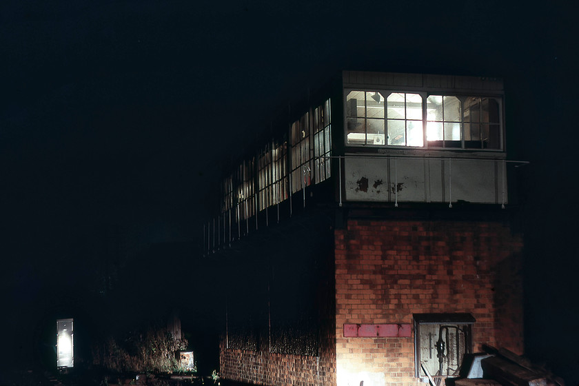 Elstree signal box illuminated by UAM`s-lights (Midland, date not known) 
 By the time Graham and I had reached the north London suburbs it was dark. Struggling for light at Elstree, we directed the headlights of the Mini (UAM) as best as we could and a reasonable picture resulted. I am not at all sure what the signalman will have thought? The Midland signal box was located between the station and the tunnel, and I cannot remember how we accessed this position to take this time exposure! 
 Keywords: Elstree signal box