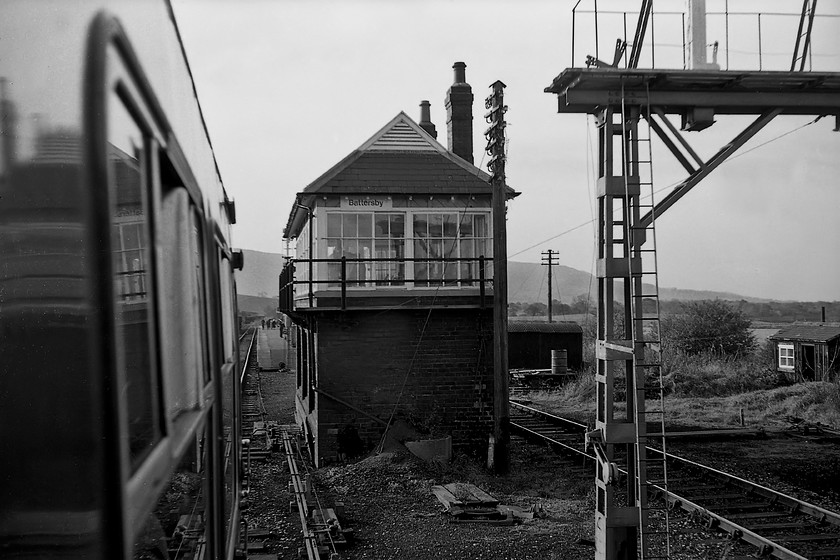 Battersby signal box (NER, 1901) 
 Another lovely North Eastern signal box is seen from the 10.13 Whitby to Middlesborough DMU as we enter the station. It must be a particularly cold location as the box has two chimney stacks indication a pair of coal-burning fires or stoves inside to keep the staff warm in the winter. Notice that in common with a number of NER boxes that it has a gablet or Dutch gable with ventilators that were unique to these boxes. The signal box was closed in 1989 when the line was transferred to No Signalman Token Remote (NSTR) signalling with it being demolished 1991. 
 Keywords: Battersby signal box NER North eastern Railway