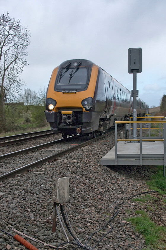 221125, XC 06.11 Leeds-Plymouth (1V44, 1E), Brockhampton SO938262 
 The 1V44 06.11 Leeds to Plymouth service speeds past the small hamlet of Brockhampton just to the north of Cheltenham worked by 221105. This very quiet spot is down a small lane that crosses the railway with a pair of user-controlled gates permitting access to a footpath. Since my last visit during the summer of 2012 the trees have been largely cleared from the lineside in this area and this new and rather obtrusive LED colour light has been installed. 
 Keywords: 221125 06.11 Leeds-Plymouth 1V44 Brockhampton SO938262CrossCountyr Voyager XC