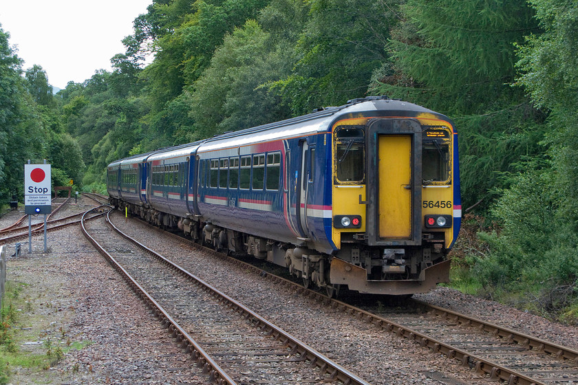 156456, SR 10.10 Mallaig-Glasgow Queen Street (1Y44), Spean Bridge station 
 Passing the RETB board at the end of Spean Bridge station, 156456 gets underway with the 10.10 Mallaig to Glasgow Queen Street 1Y44 service. After a couple more stops, the train will then commence its climb up to Corrour station along the side of Loch Treig; one of the most dramatic stretches of railway in the country. 
 Keywords: 156456 10.10 Mallaig-Glasgow Queen Street 1Y44 Spean Bridge station ScotRail Sprinter