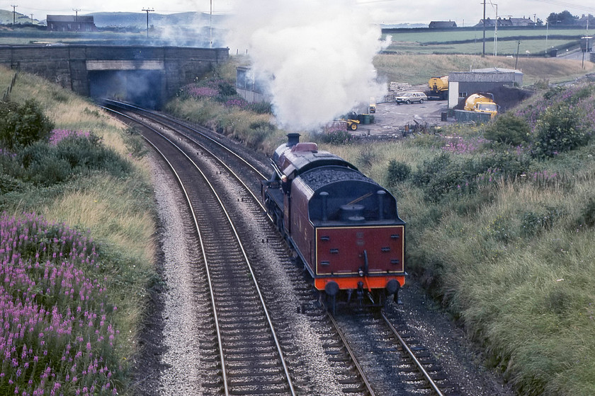 5690, Carnforth-Sellafield light engine, Lindal SD262746 
 Following 4498 'Sir Nigel Gresley' leading The Cumbrian Coast Express, 5690 'Leander' runs tender first past Lindal. The purpose of this light engine movement from Carnforth was so Leander could lead the train back from Sellafield facing the right way. 4498 would then return in a mirror image tender first light engine movement. A solution to me that would have avoided this would be for 4498, on arrival at Sellafield, to run round the stock and return light engine back to Barrow-in-Furness and run all the way around the town to run tender first back to Sellafield again. But, who am I to suggest that and if it meant that we got two different steam locomotives on the out and back workings then, heh! 
 Keywords: 5690 Carnforth-Sellafield Lindal SD262746