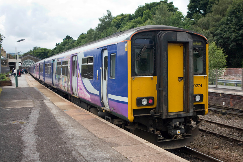 150274, NT 14.29 Buxton-Manchester Piccadilly (2H03), Buxton station 
 Having recently arrived from Manchester Piccadilly, 150274 will return there in the next thirty minutes or so as the 14.29 2H03 service. 
 Keywords: 150274 14.29 Buxton-Manchester Piccadilly 2H03 Buxton station