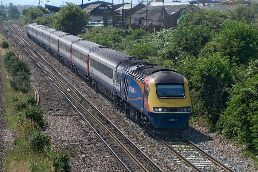 43076, EM 10.15 London St. Pancras-Nottingham (1D22), Finedon Road industrial estate SP900702 
 I think that the EMR livery really suits the HST sets with the company keeping their trains looking smart. Just north of Wellingborough near to the town's Finedon Road industrial estate 43076 leads the 10.15 St. Pancras to Nottingham service. Unfortunately, I did manage to catch the number of the trailing power car. 
 Keywords: 43076 10.15 London St. Pancras-Nottingham 1D22 Finedon Road industrial estate SP900702 EMR East Midlands Railway HST