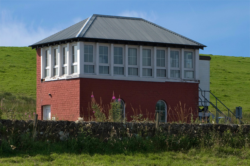 Greenloaning signal box (Caledonian, 1891) 
 Greenloaning signal box was another one that required quite a trek! It is a refurbished Caledonian structure dating from 1891 that still retains its frame room windows. The box is usually switched out but was in use on the day of our visit. Unfortunately, I missed the last remaining co-acting signal post on the Scottish network located on the up main with twin GL27 arms, very close to where I left Andy in the parked up hire car; another example of the one that got away! 
 Keywords: Greenloaning signal box Caledonian