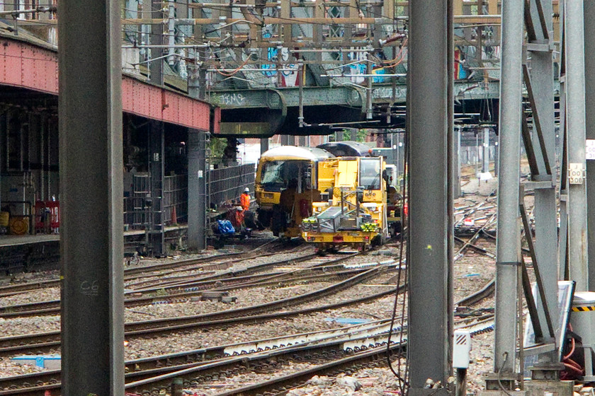 165124, undergoing re-railing following ECS derailment @18.00, 16.06.16, London Paddington station 
 Paddington was operating under a bit of pressure over the weekend of my visit due to the derailment of the Turbo 165124. It is seen here being recovered following its collision with an electrification mast. Thankfully, it was running into the station as ECS with nobody on-board except the driver; thankfully he was not injured. The RAIB report into the accident can be found at ..... https://www.gov.uk/government/publications/paddington-safety-digest/derailment-at-paddington-16-june-2016 
 Keywords: 165124 derailment London Paddington station