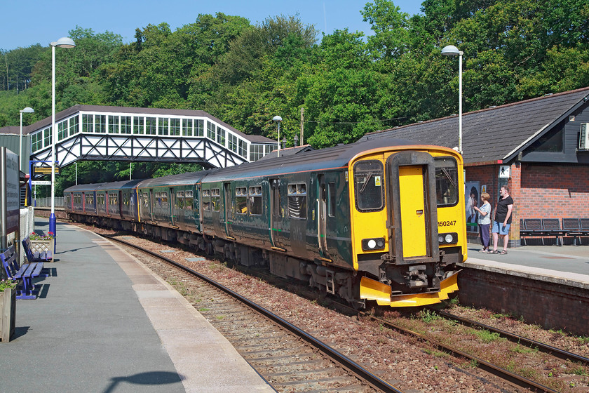 150247 & 150102, GW 15.57 Plymouth-Penzance (2C48, 2E), Bodmin Parkway station 
 The all-stations 15.57 Plymouth to Penzance working pauses at Bodmin Parkway station in the afternoon sun. The train is composed or 150247 and 150102. Under the HST cascade plans for 2018, it is likely that these somewhat inadequate units will go elsewhere and that these services will be handled by short-set HSTs that have become available due to the introduction of the IET class 800s. 
 Keywords: 150247 150102 2C48 Bodmin Parkway station