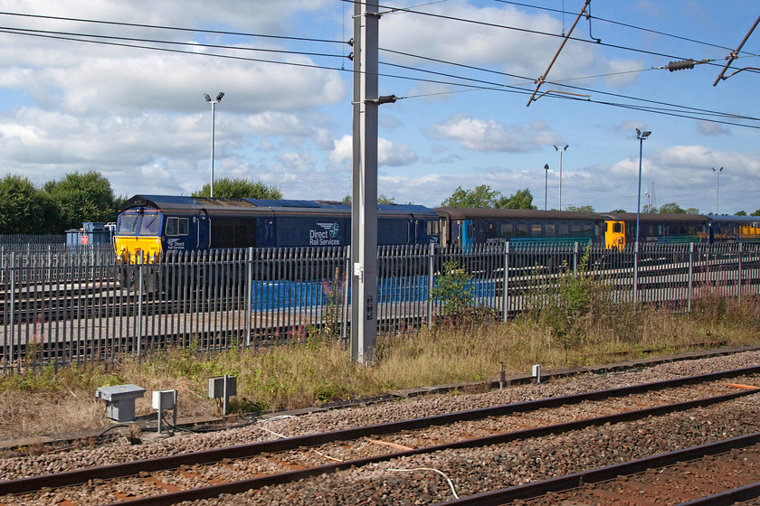 66423, stabled, Kingmoor MPD 
 66423 is seen stabled at DRS's Kingmoor depot along with some of their coaching stock. 
 Keywords: 66423 Kingmoor MPD