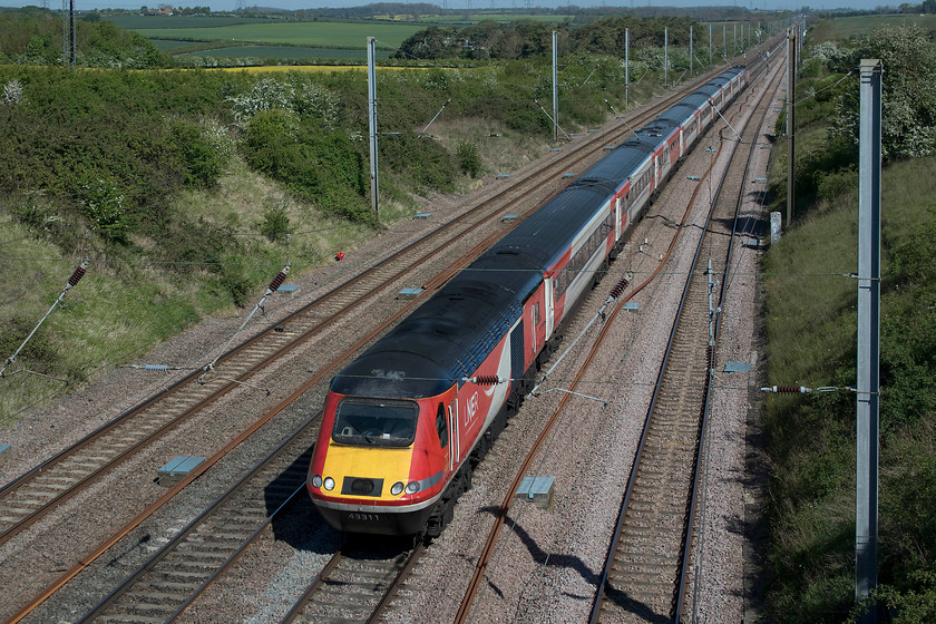 43311, GR 07.34 Harrogate-London King`s Cross (1A15, 10L), Essendine TF043129 
 A scene that was typical of much of the southern ECML at Essendine between Peterborough and Grantham. Looking north up Stoke Bank HST power car 43311 leads the 07.34 Harrogate to London King's Cross. When I first visited this spot in August 1979, I was photographing Deltics from this bridge probably cursing the HSTs, see.....https://www.ontheupfast.com/p/21936chg/29682537404/x2-40-101-up-parcels-working-essendine. Forty years later, this day is the final one before the introduction of the Azumas that will precipitate the withdrawal of the HSTs on this route. 
 Keywords: 43311 07.34 Harrogate-London King`s Cross 1A15 Essendine TF043129