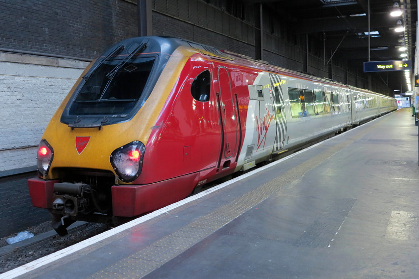 221101, VT 16.10 London Euston-Bangor (1D90, 4L), London Euston station 
 At the very western side of Euston station is the unattractive platform 18. It's a desolate area of wide open concrete with poor lighting. Here, 221101 'Louis Blriot' waits to leave the confines working the 16.10 to Bangor. 
 Keywords: 221101 16.10 London Euston-Bangor 1D90 London Euston station