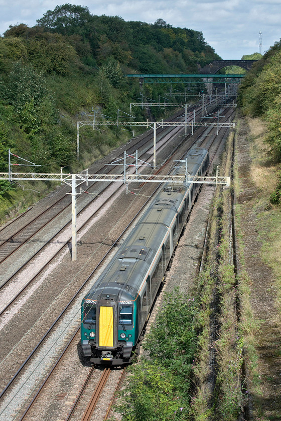 350263, LN 08.05 Liverpool Lime Street-London Euston (9Y04, RT), Roade cutting 
 Its not often that the train is in the sun and the background is in shade, normally things conspire to make it the other way around! 350263 passes through Roade cutting forming the 08.05 Liverpool Lime Street to Euston 9Y04 service. This is one of the newly introduced Liverpool direct services that came into operation from the new May timetable. 
 Keywords: 350263 08.05 Liverpool Lime Street-London Euston 9Y04 Roade cutting